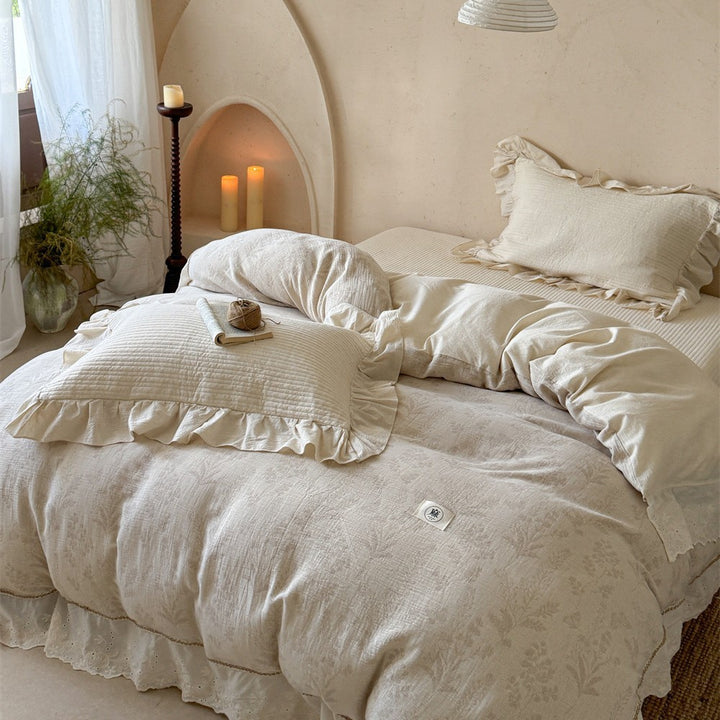 Luxurious quilted cotton bedding set with ruffles and embroidered details