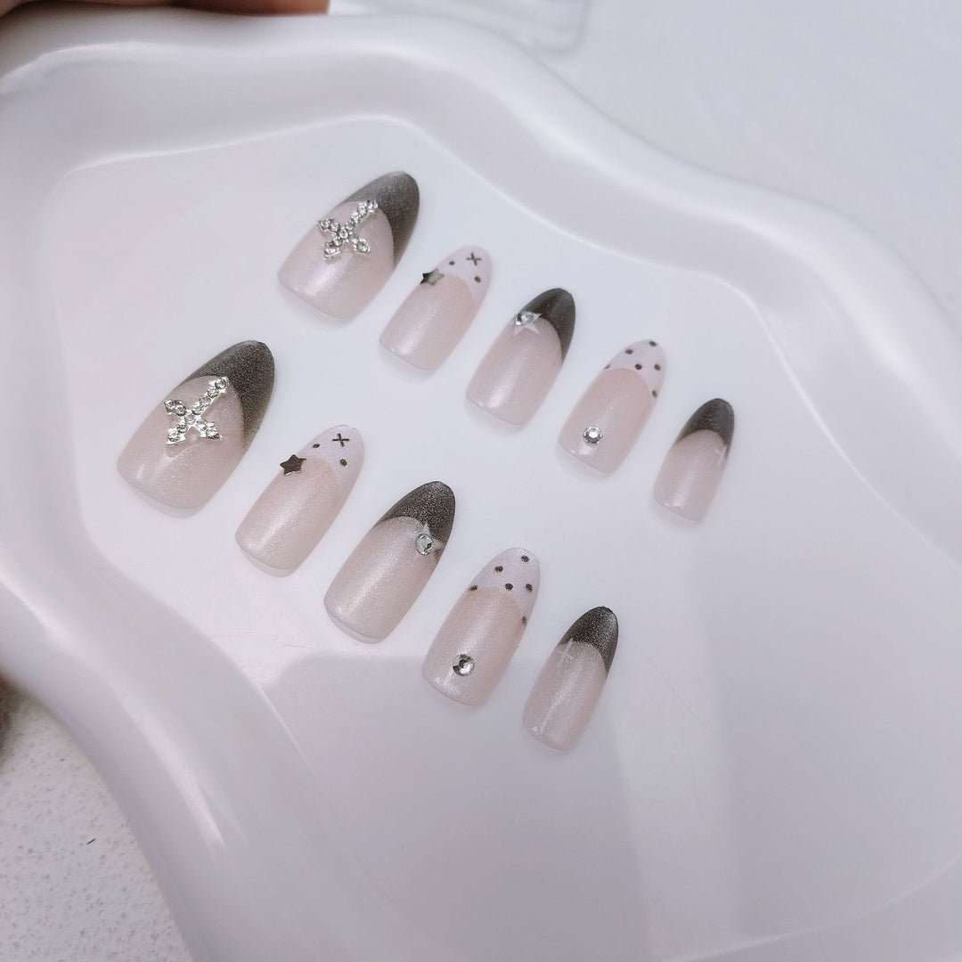 Glittering artificial nail design with elegant accents Stornfield