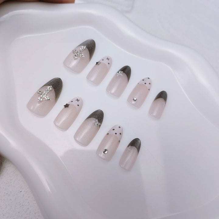 Glittering artificial nail design with elegant accents Stornfield
