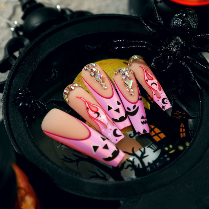 Artificial nail art with festive design and glitter variations Stornfield