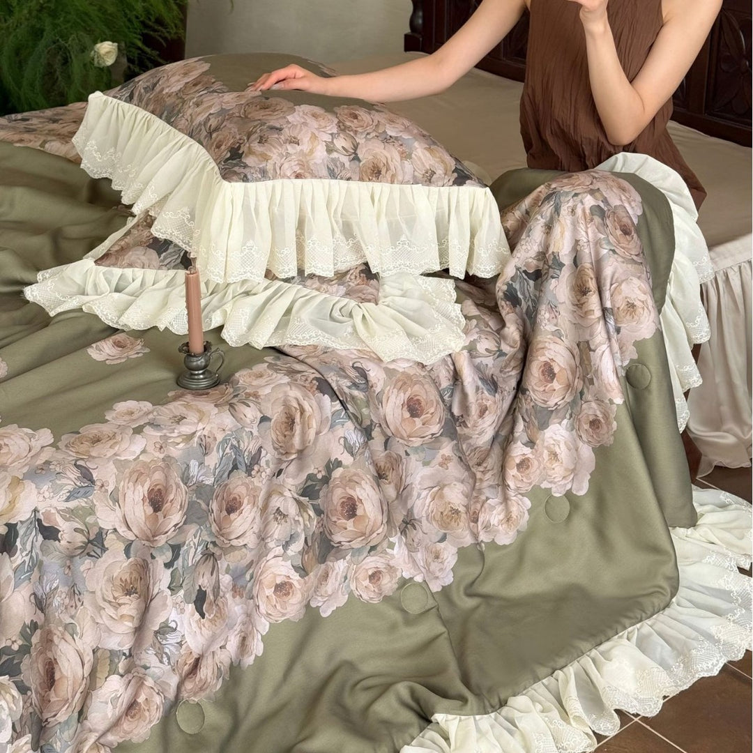 Vintage-inspired satin bedding with elaborate ruffled flounces and rose embroidery