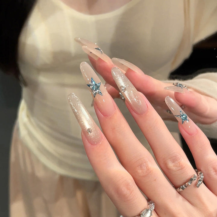 Glamorous artificial nails with star accents Stornfield