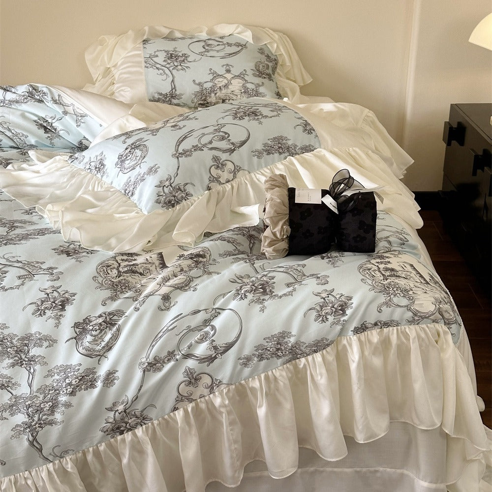 Romantic satin bedding set with ruffles, frills, and classic toile motif