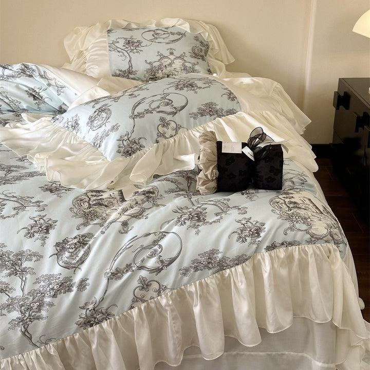 Romantic satin bedding set with ruffles, frills, and classic toile motif