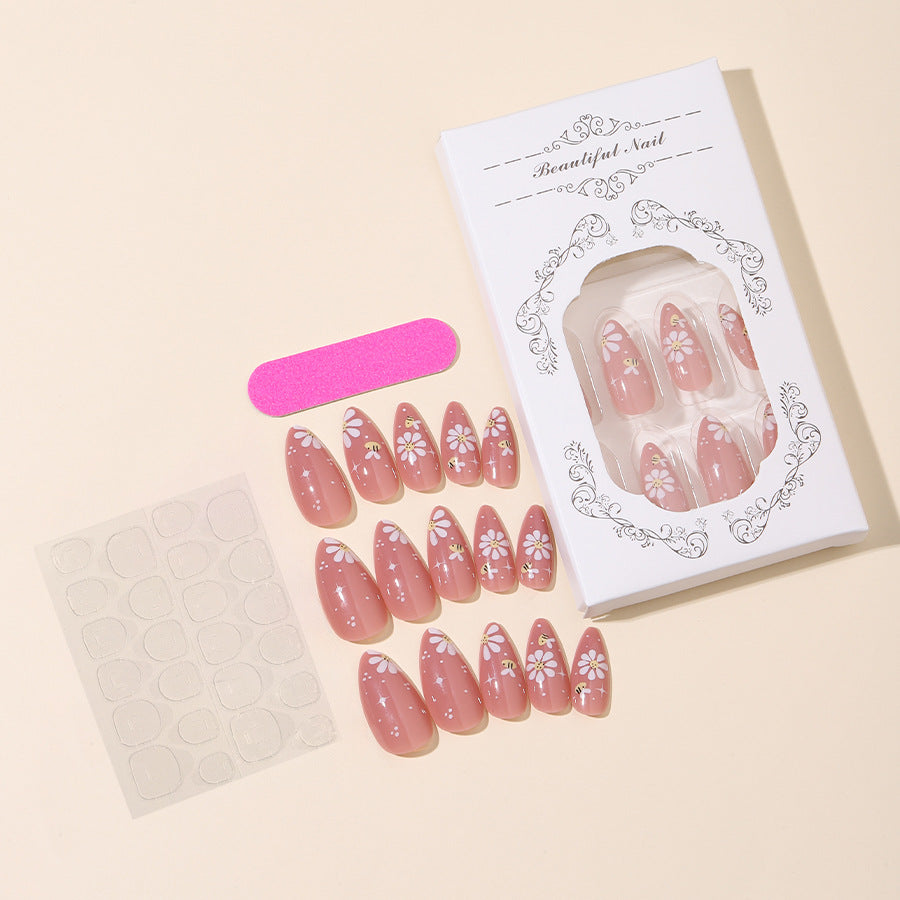 Artificial nails set with elegant flowers and glitter accents Stornfield