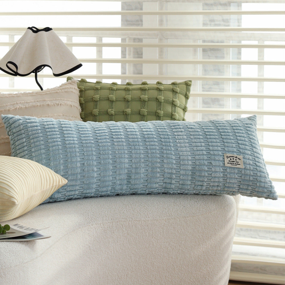 Long decorative pillows with structured surface