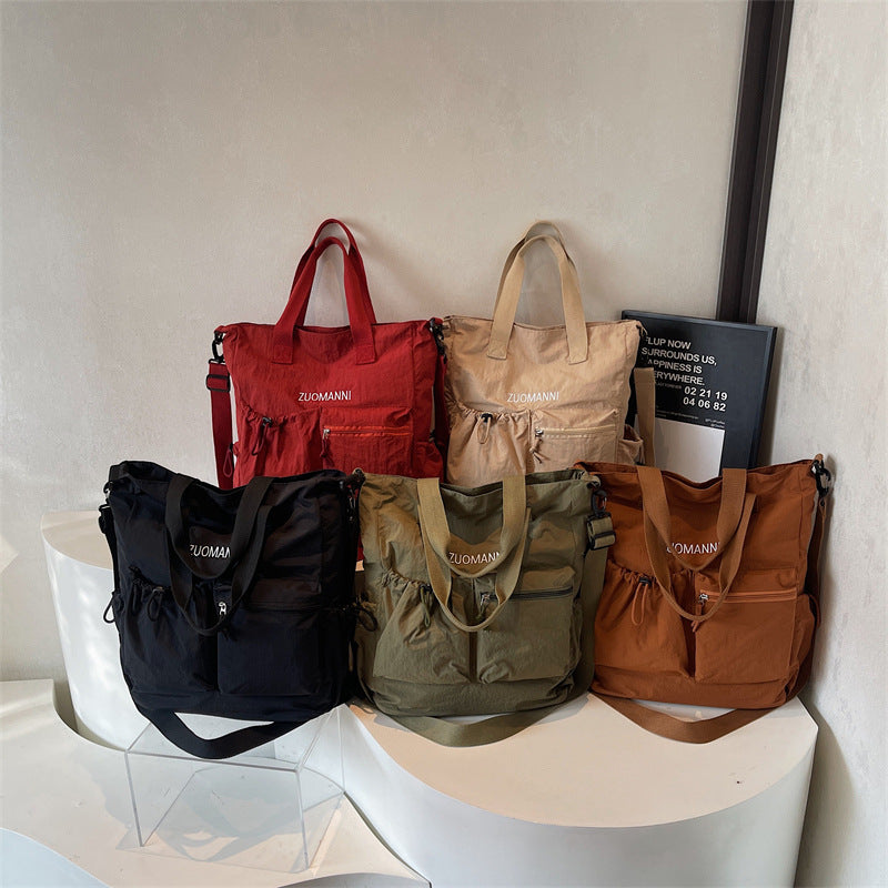 Tote bag with multifunctional outer pockets and adjustable shoulder strap Stornfield