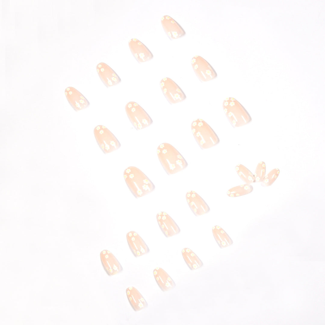 Artificial nail art with floral design and glitter accents Stornfield