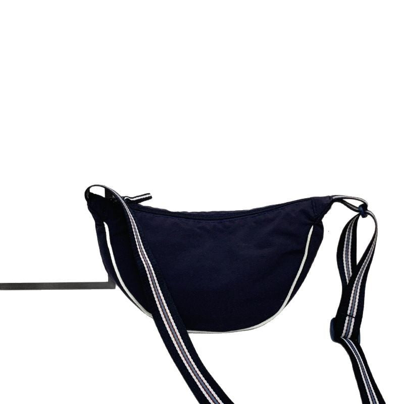 Fashionable shoulder bag with unique cut and adjustable strap Stornfield