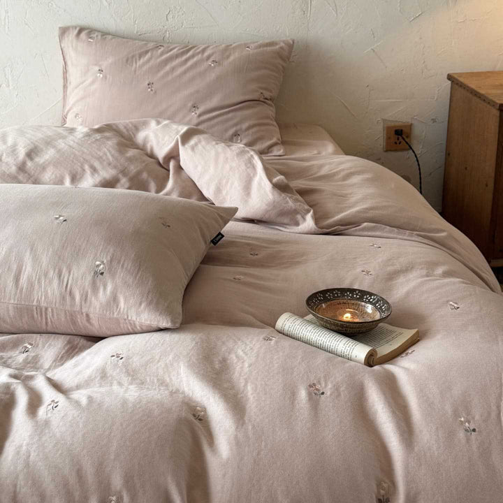 Breathable cotton bedding set with delicate flower embroidery and tie ribbon pillow