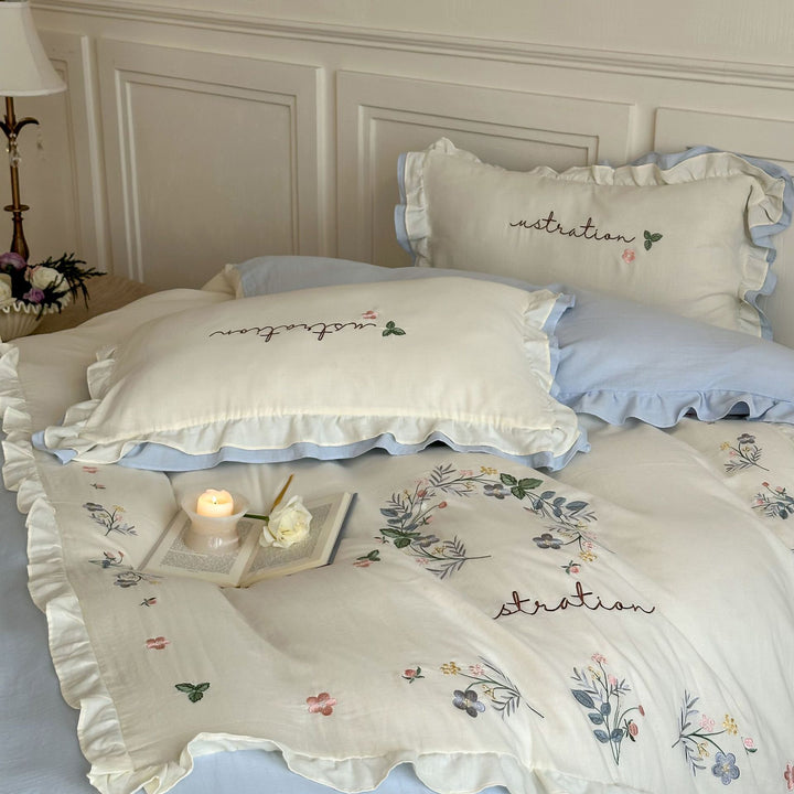 Cotton bedding set in country house style with ruffle edge and fine floral embroidery Stornfield
