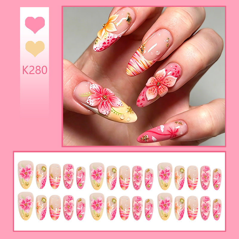 Artificial nails with floral embellishments and glitter accents Stornfield
