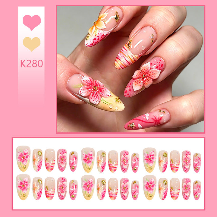 Artificial nails with floral embellishments and glitter accents Stornfield