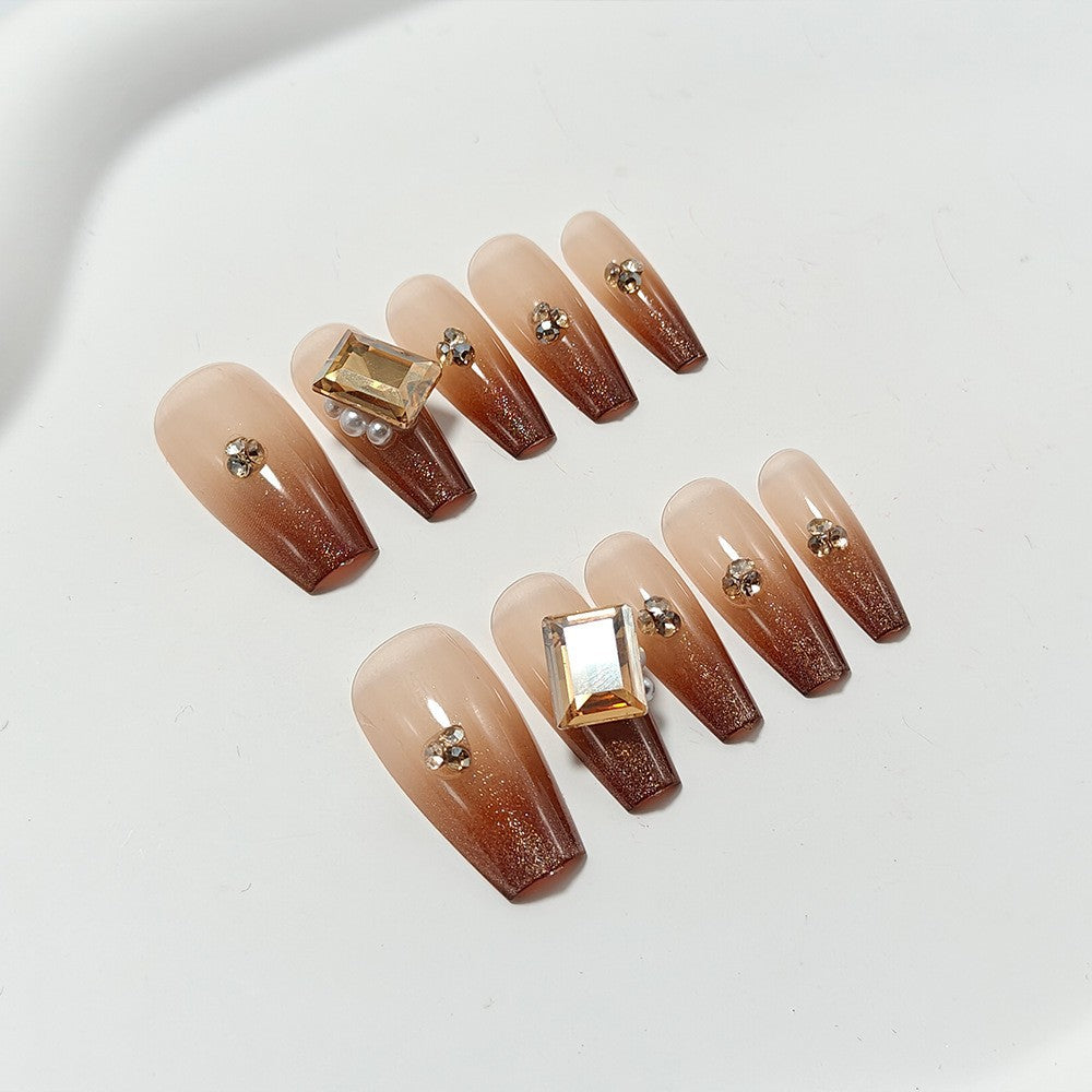 Artificial nails with elegant ombre effect and exquisite gemstones Stornfield
