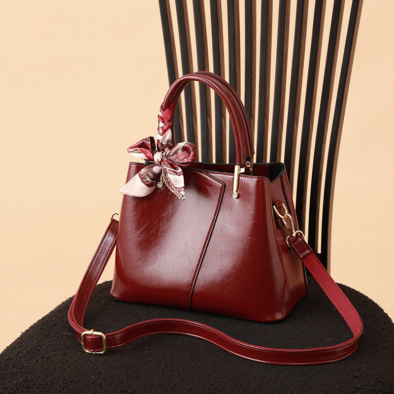 Stylish Structured Handbag with Decorative Scarf