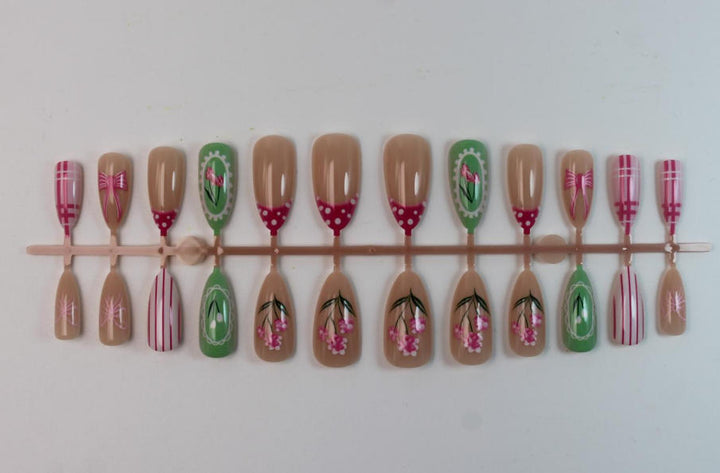 Acrylic nail set with floral and playful designs Stornfield