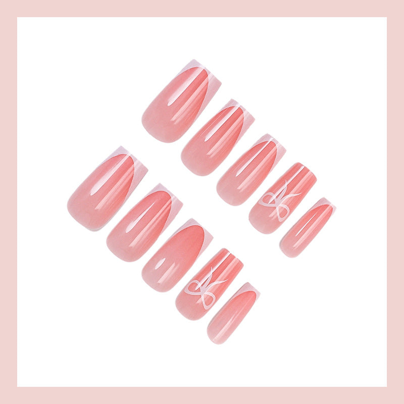 Artificial nail set with elegant tips and delicate bow motifs Stornfield