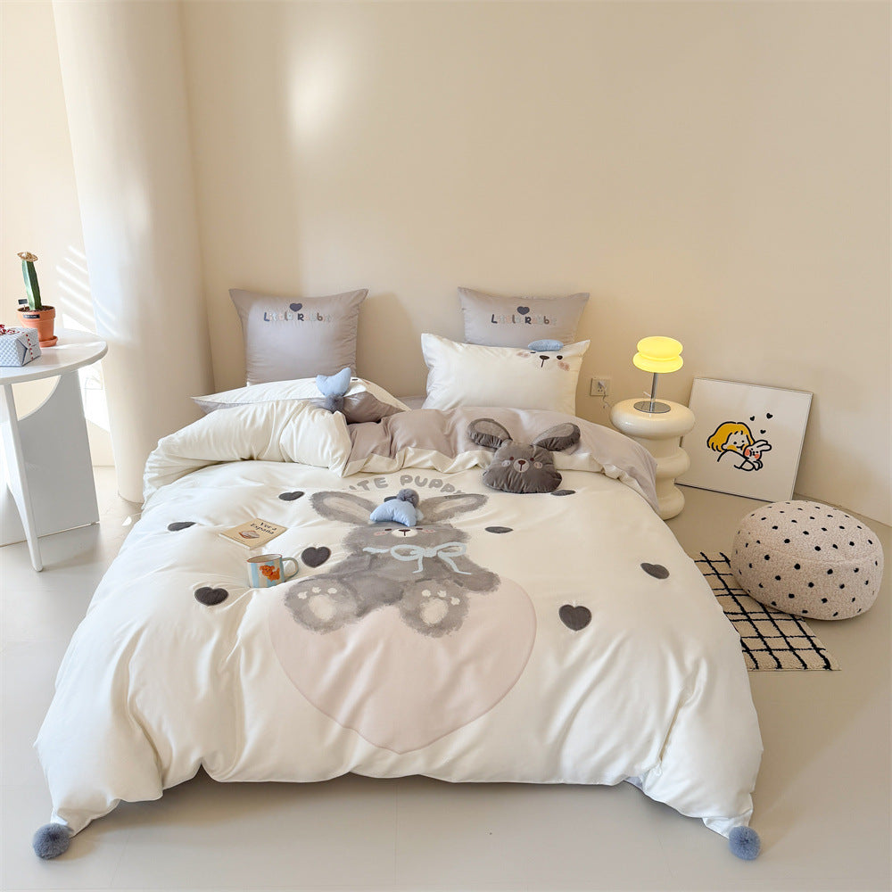 Children's bedding set with large rabbit motif, plush appliqué and pom-pom corners