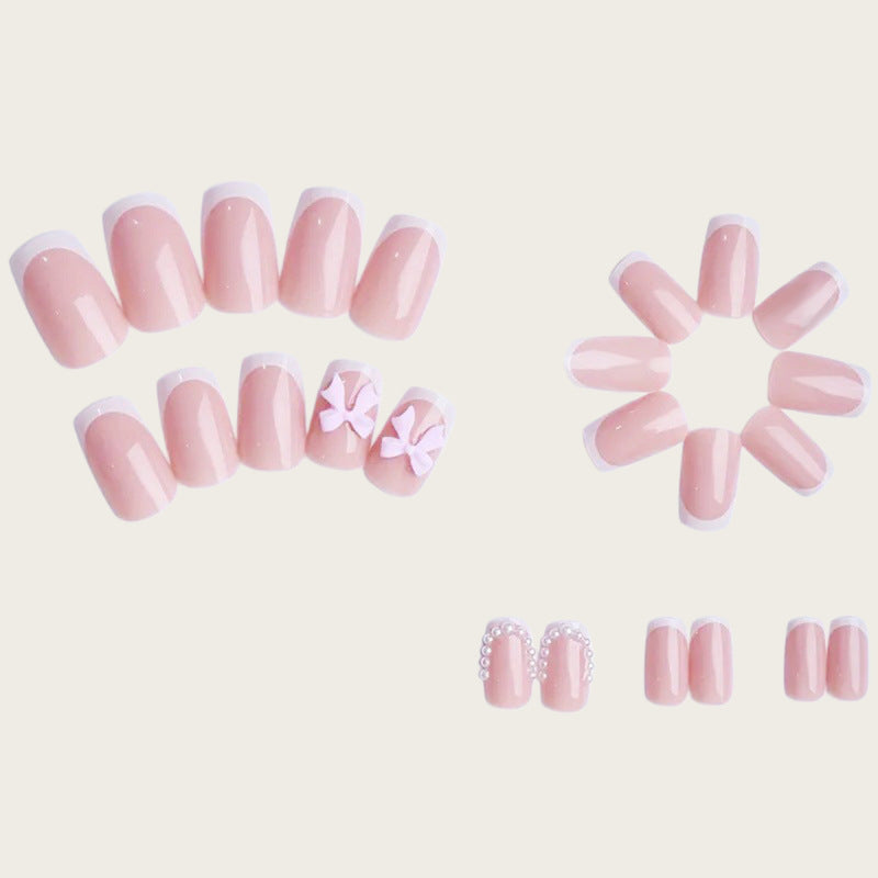Exclusive artificial nails with decorative bows and pearl details Stornfield