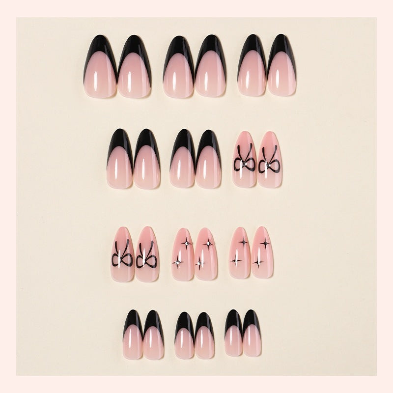 Acrylic nail set with elegant ombre design and creative bow motif Stornfield