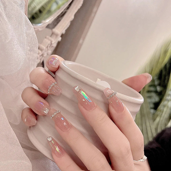 Acrylic nail set with glamorous rhinestone and glitter elements Stornfield