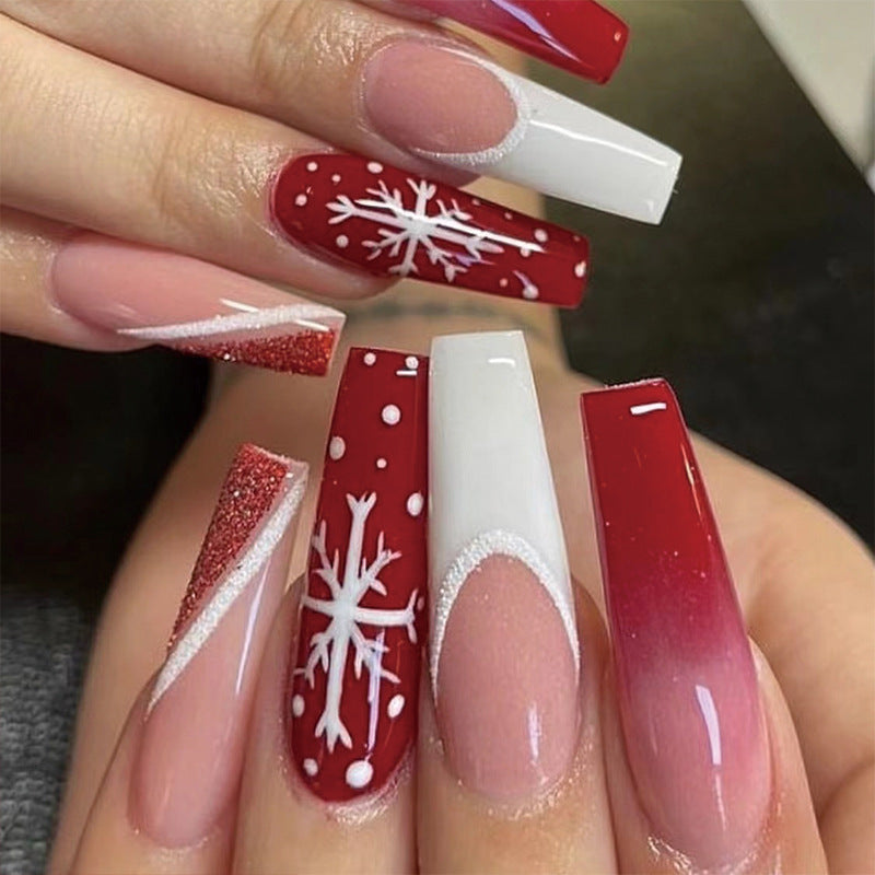 Artful Christmas nail extensions with elegant glitter and snowflake design Stornfield