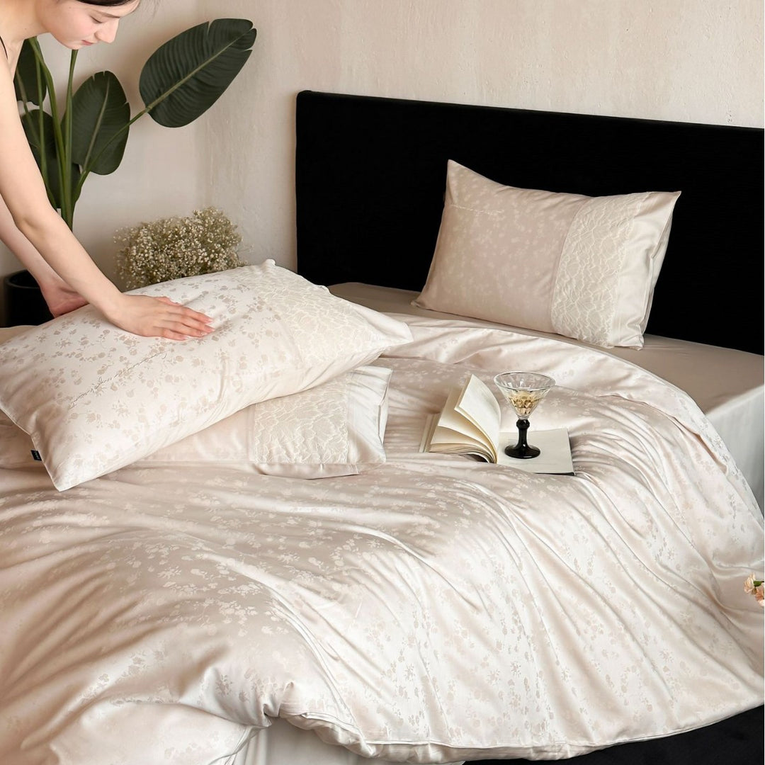 Satin bed set with subtle floral jacquard, reversible look and elegant piping seam