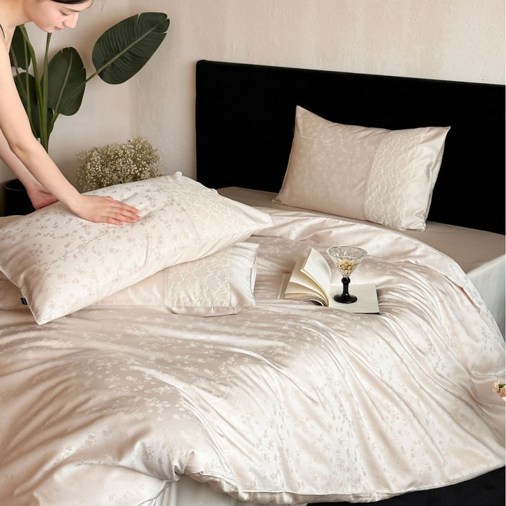 Satin bed set with subtle floral jacquard, reversible look and elegant piping seam