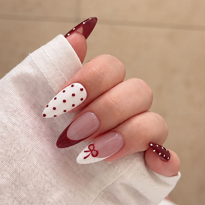 Nail set with elegant bows and polka dots Stornfield
