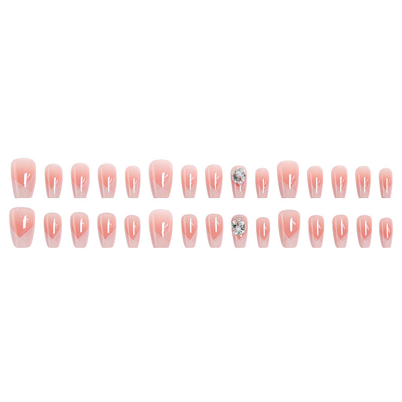 Artificial nail set with filigree tip designs and glamorous rhinestone accents Stornfield
