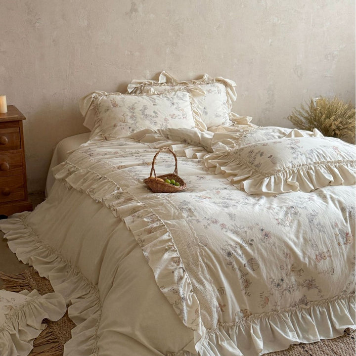Romantic bedding set with ruffles, floral jacquard application and decorative cushions
