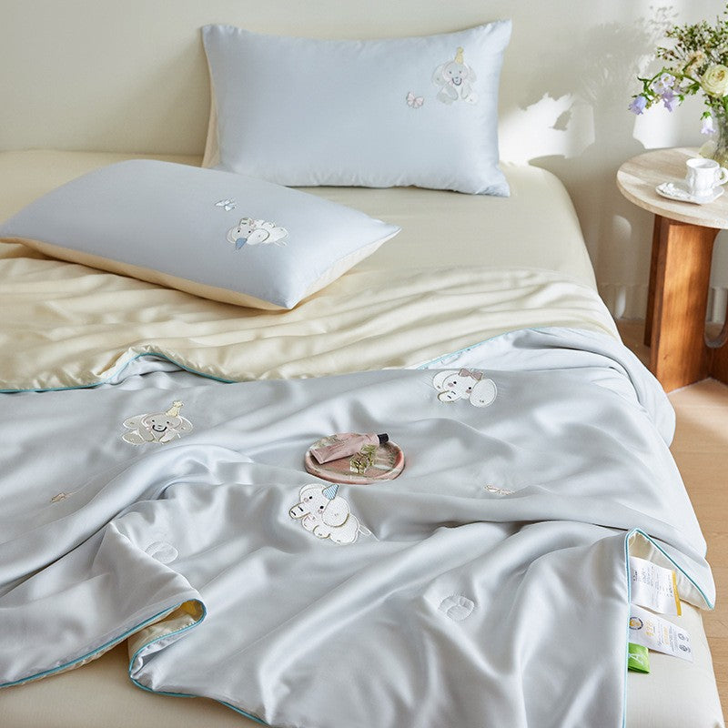 Luxurious satin bed linen set with embroidered Christmas tree motifs and contrasting piping