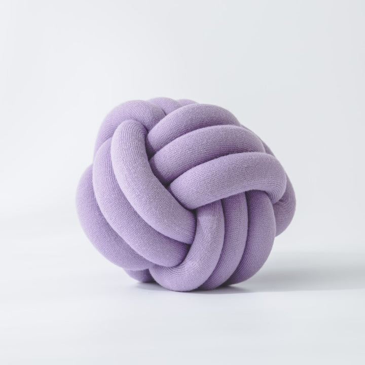 Decorative knitted knot cushion as a decorative pillow made of soft jersey