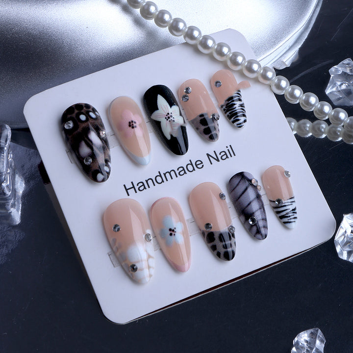 Nail art with elegant designs and embellishments Stornfield