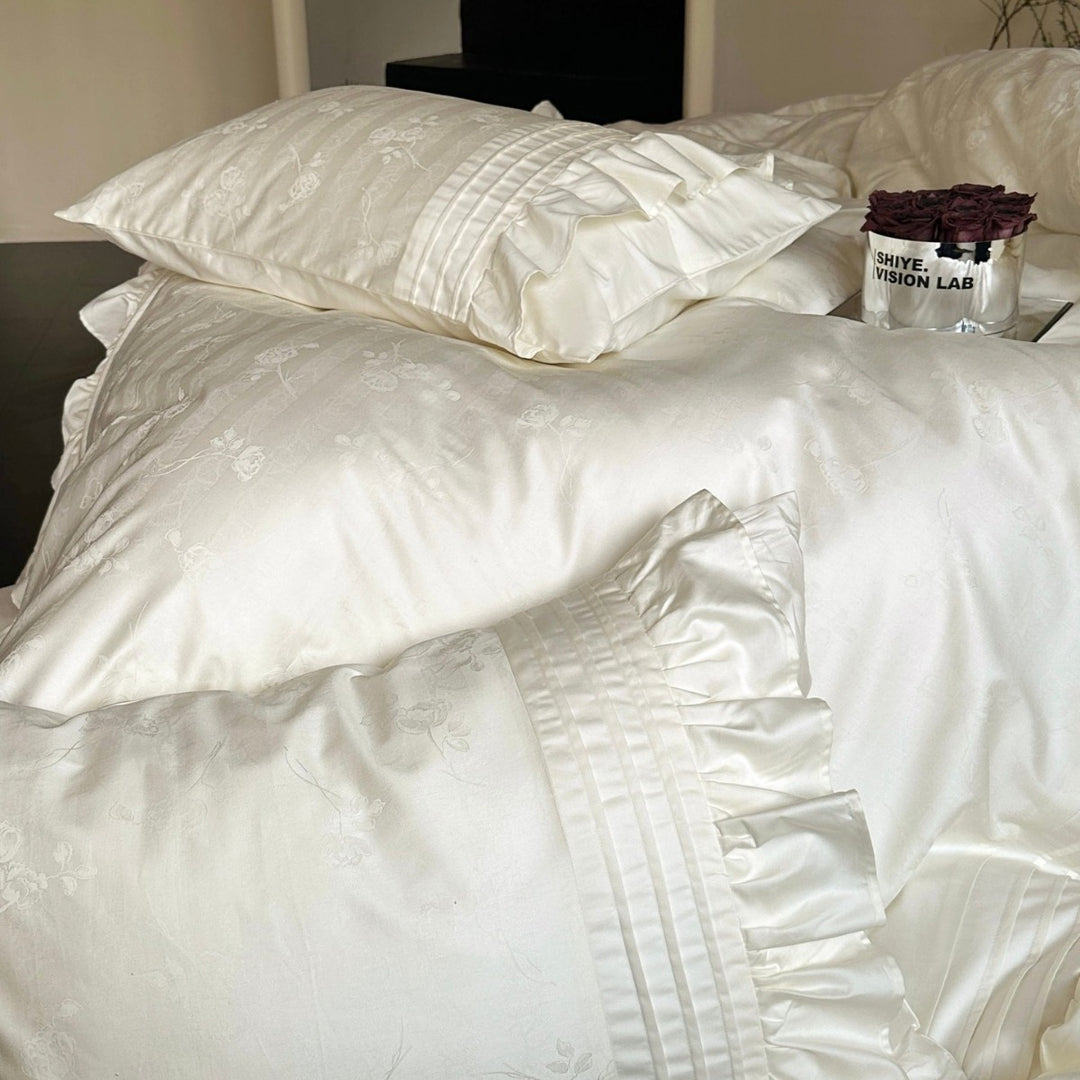 Luxurious satin bedding set with ruffles and delicate floral embroidery