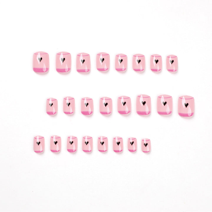 Creative Nail Art with Heart Design and Glitter Accents Stornfield