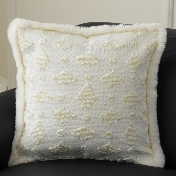 Square decorative pillow with embossed circular relief and soft faux fur edging