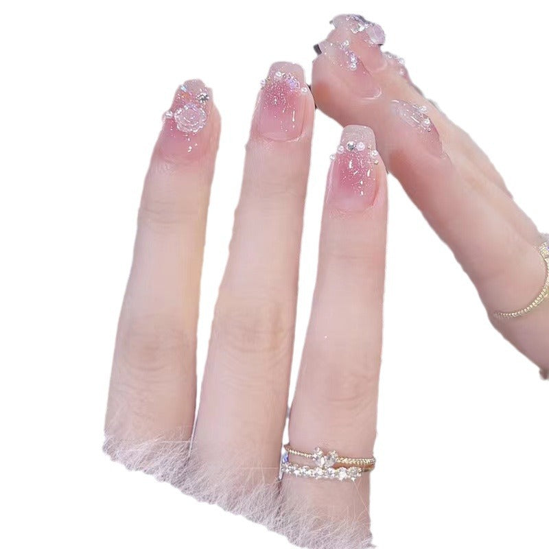 Glamorous nail art with rhinestone and pearl accents Stornfield