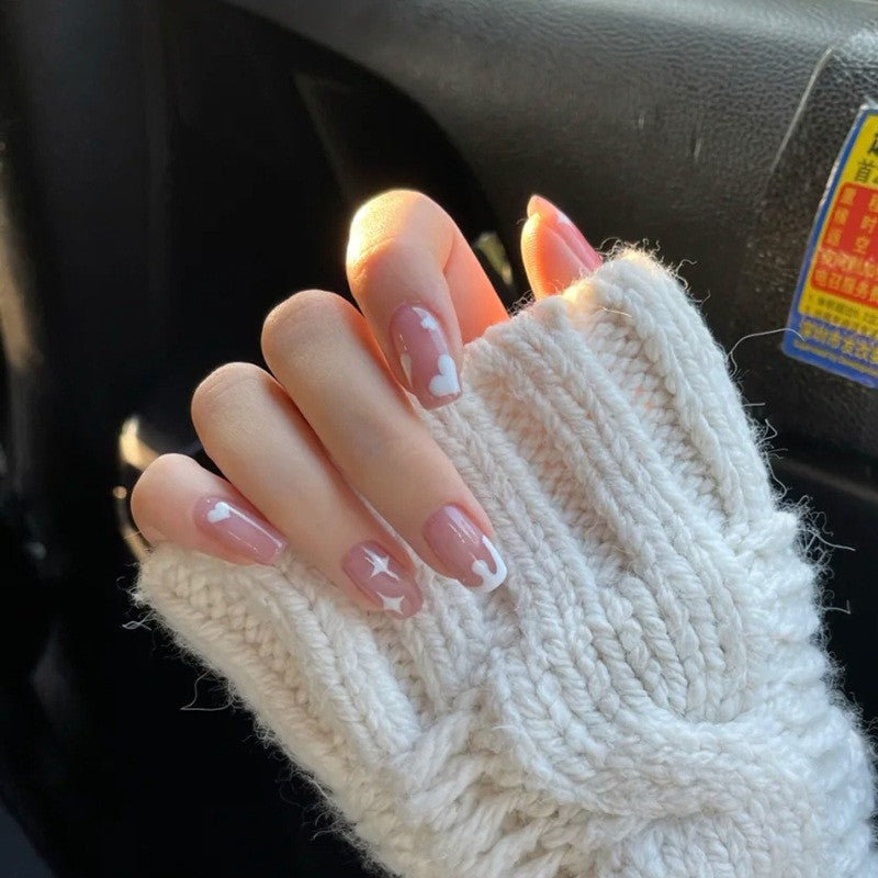Artificial nails with elegant bow accents and pearl decorations Stornfield