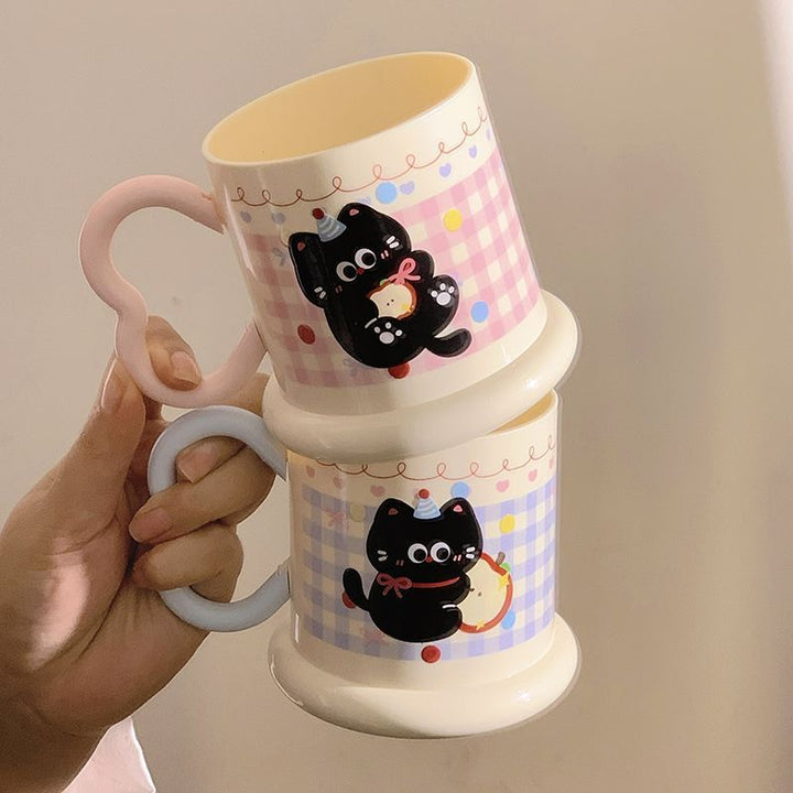 Ceramic mug with playful cat motif Stornfield