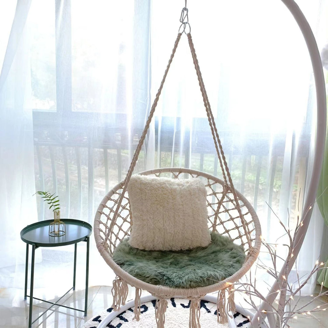 Boho macrame hanging swing chair with faux fur cushion and fringe Stornfield