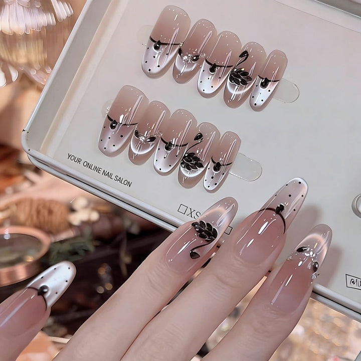 Artistic Stiletto Press-On Nail Art with Glimmering Accents Stornfield