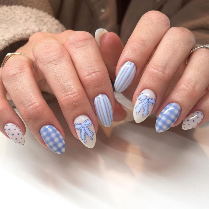 Artificial nail art with playful dots and bows Stornfield