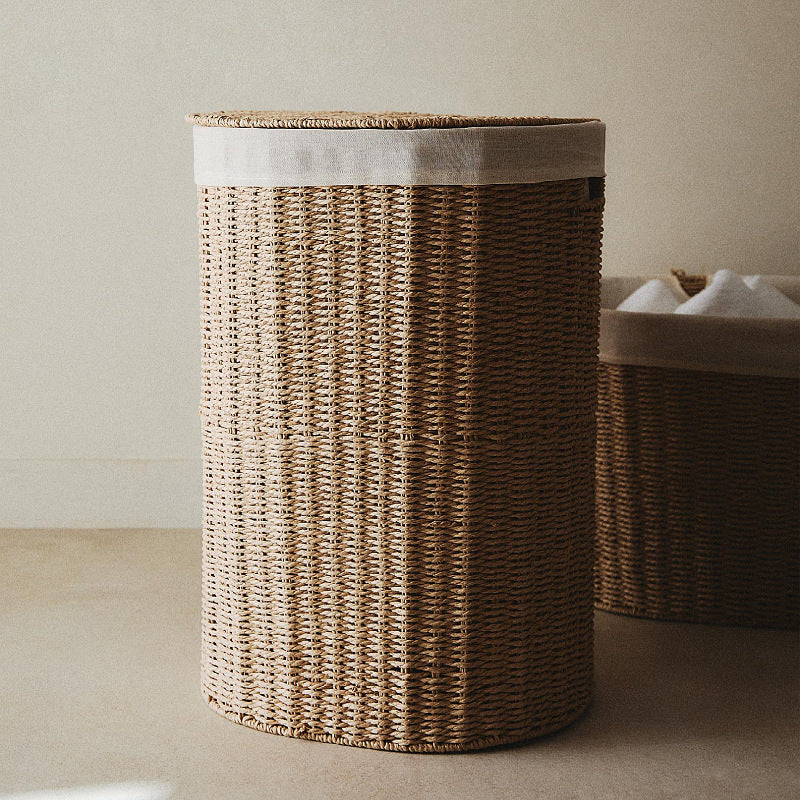 Round laundry basket made of natural materials Stornfield