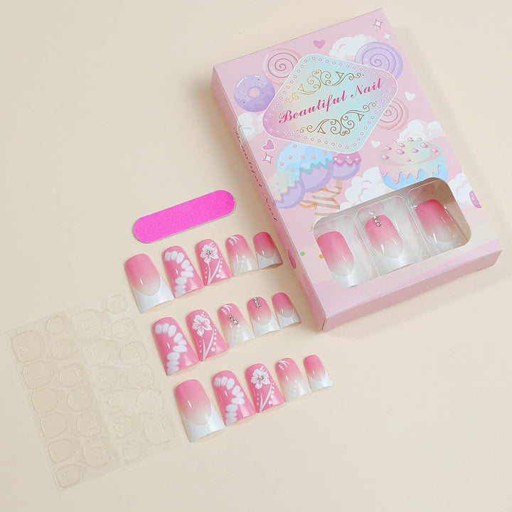Acrylic nail set with elegant floral designs and glitter accents Stornfield