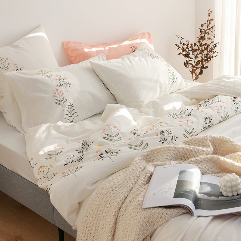 Embroidered cotton muslin bedding set with delicate flower appliqués and extra soft fitted sheet