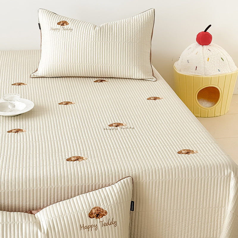 Padded fitted sheet set with vertical quilting and subtle floral embroidery