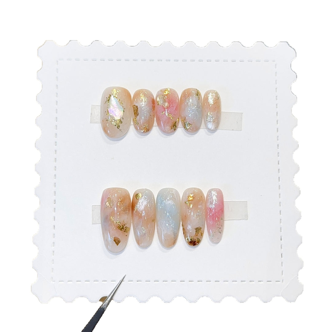Artificial nails with glamorous metallic details and sparkling design Stornfield