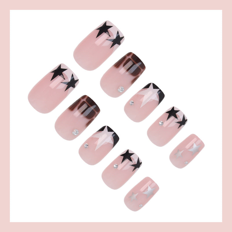 Acrylic nail set with glamorous star and glitter accents Stornfield