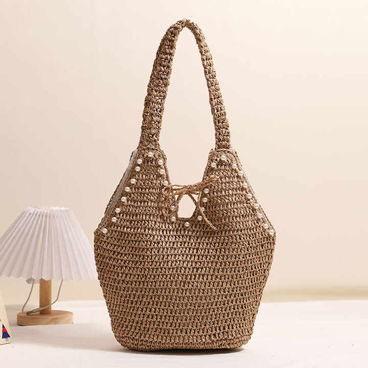 Handbag with pearl decor and innovative closure Stornfield